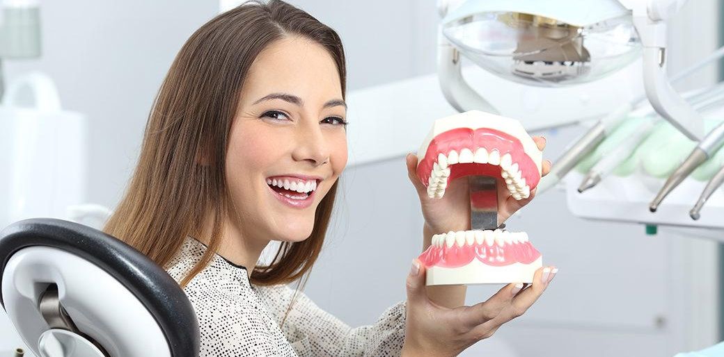 Women holding the Dental Jaw