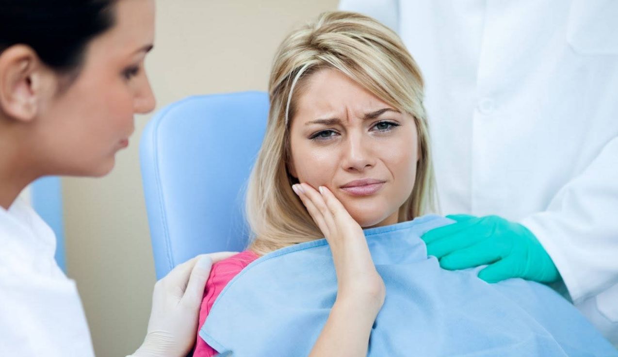 Girl suffering from Dental Pain