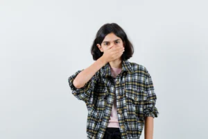 Expressive young girl posing after successful dental implant recovery
