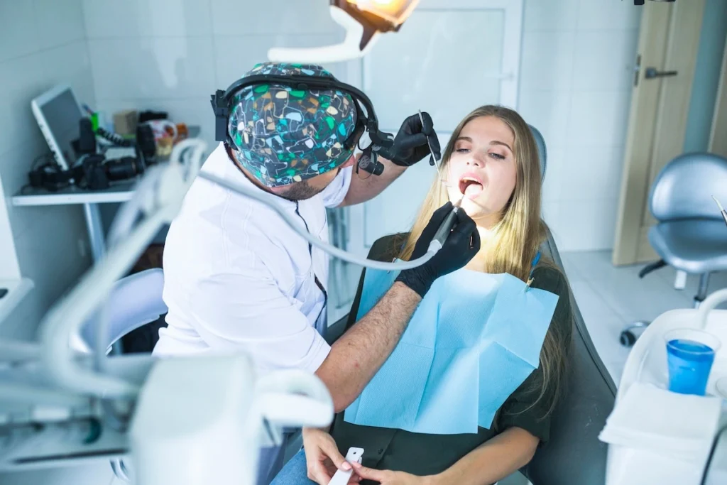 Dentist treating patient with All on 4 dental implants for full smile restoration